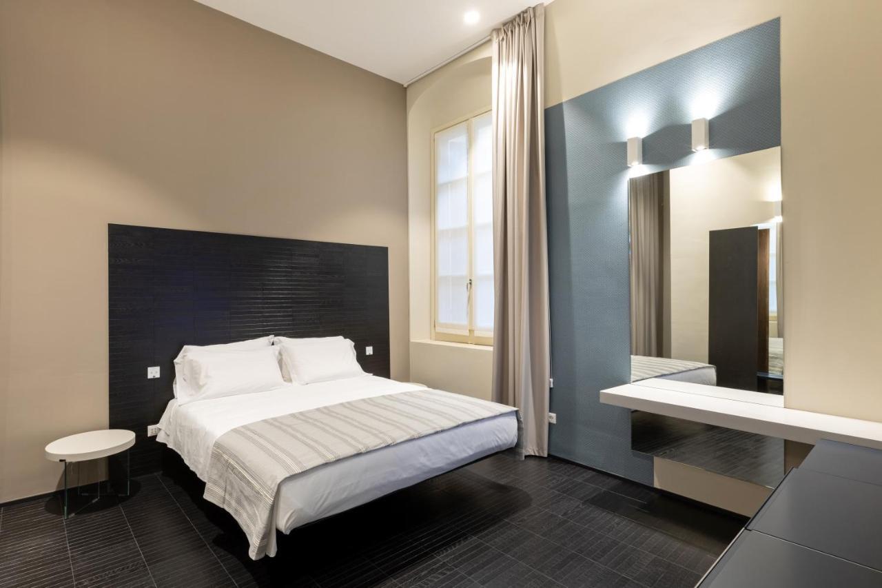 Salina Luxury Suites Parma Bagian luar foto
